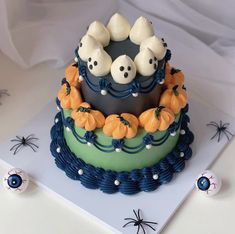 a halloween cake decorated with white and blue icing