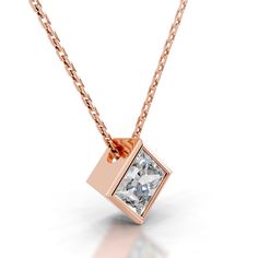 a necklace with a square shaped diamond in the center and a chain attached to it