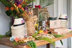 there are many items on the table with flowers