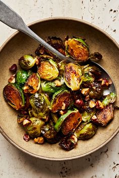 brussel sprouts and brussels sprouts in a bowl with a spoon