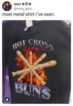 a t - shirt that says hot cross buns on the front and back with flames coming out of it