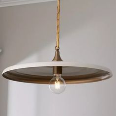 a light fixture hanging from the ceiling in a room