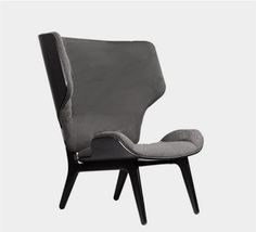 an upholstered chair with a black frame and grey fabric on the armrests