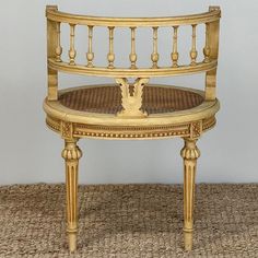 a wooden chair sitting on top of a carpeted floor