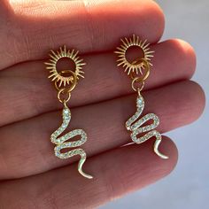 14k Gold Plated Over Brass Sun & Snake Stud Earrings. Yellow Gold With A Warm Undertone. Your Earrings Will Come Well Packaged And Gift-Ready In A Black Mesh Baggie. Drop: 40 Mm Length/Width: 40 Mm / 11 Mm Each Earring Weighs 1.6 Grams Snake Hoop Earrings, Symbolic Hypoallergenic Drop Earrings, Hypoallergenic Symbolic Drop Earrings, Symbolic 14k Gold Pierced Jewelry, Symbolic Yellow Gold Jewelry For Pierced Ears, Gold Symbolic Dangle Jewelry, Symbolic Gold Dangle Jewelry, Symbolic Yellow Gold Dangle Jewelry, Gold Plated Symbolic Earrings