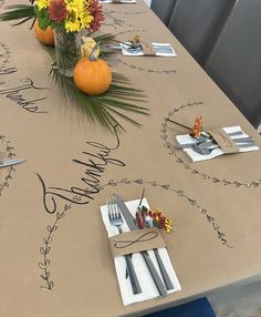 the table is set with place settings for two people to sit at and have their name written on it