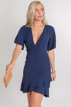 Ellis Sheath Dress, Navy :: NEW ARRIVALS :: The Blue Door Boutique Chic Navy V-neck Mini Dress, Short Sleeve V-neck Dress With Ruffle Hem For Brunch, Flirty Dress With Ruffle Hem And Surplice Neckline, Elegant Short Sleeve Ruffle Dress For Date Night, Chic Short Sleeve V-neck Dress With Ruffle Hem, Chic Navy Midi Dress With Ruffles, Chic V-neck Dress With Ruffle Hem And Flutter Sleeves, Short Sleeve Ruffle Dress For Date Night, Short Sleeve V-neck Dress With Ruffles For Date Night