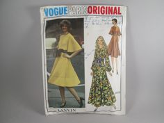 an old fashion magazine with two women's dresses on it