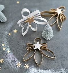 three different types of christmas decorations on a gray surface with gold stars and snowflakes