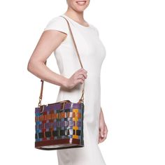 You're sure to love the colorful and unique style of this AmeriLeather basket-style handbag. You're sure to love the colorful and unique style of this AmeriLeather basket-style handbag. HANDBAG DETAILS 9"H x 5.5"W x 12.5"L Removable/adjustable crossbody strap Shoulder strap length: adjusts to 44 in. Adjustable handles Handle: 5.5'' drop Water repellent Copper-tone hardware Zipper closure Interior: 2 slip pockets, 1 zip pocketCONSTRUCTION & CARE Body: canvas/leather Wipe clean Imported Size: One Leather Bucket Bag With Braided Handles In Basket Shape, Chic Leather Basket-shaped Bucket Bag, Chic Leather Basket Bucket Bag, Chic Leather Bucket Bag In Basket Shape, Multicolor Leather Crossbody Bucket Bag, Chic Leather Bucket Bag With Basket Shape, Multicolor Satchel Bucket Bag, Multicolor Leather Satchel Bucket Bag, Multicolor Satchel-shaped Bucket Bag