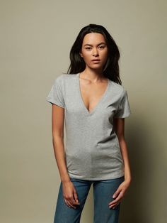 Part of our Organic Cotton essentials collection, this universally flattering slim fit tee features our deepest and most narrow V neckline yet. Our soft Peruvian Organic Cotton is hand harvested, 100% natural, and environmentally responsible. (This one comes in Heather Grey.) | Women's Blair Tee Top in Heather Grey | Ethical Essentials Essential Everyday T-shirt, Minimalist Fitted Tops For Everyday, Fitted Minimalist T-shirt For Everyday, Minimalist Fitted Everyday T-shirt, Alpaca Scarf, V Neckline, Grey Women, New Tops, Short Jumpsuit