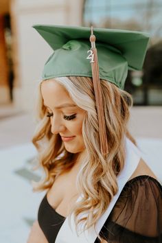 a woman wearing a graduation cap and gown