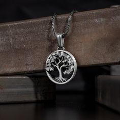 Yggdrasil the world tree necklace pendant for men or women, Engraved futhark runes sterling silver necklace, Scandinavian silver men jewelry Scandinavian sacred Tree of Life - Yggdrasill. This giant ash tree supports the universe, it grows through all the worlds. This sterling silver pendant is refined Yggdrasill's whimsical interweaving of branches and roots symbolizing the commonality of all nine worlds. This beautiful life of tree necklace is made of 925 sterling silver and decorated with spe Yggdrasil Necklace, Symbolic Silver Jewelry With Tree Of Life, Silver Tree Of Life Necklace For Jewelry Making, Symbolic Tree Of Life Sterling Silver Jewelry, Symbolic Sterling Silver Tree Of Life Jewelry, Symbolic Silver Tree Of Life Jewelry, Symbolic Silver Necklace With Tree Of Life, Sterling Silver Tree Of Life Necklace With Round Pendant, Sterling Silver Tree Of Life Round Pendant Jewelry