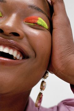 a close up of a person with colorful makeup