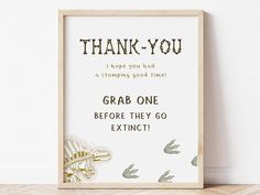 a sign that says thank you and is in front of a wall with an image of sea animals