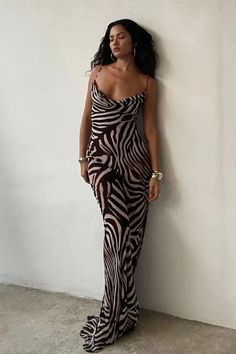 This bold maxi dress features an eye-catching combination of leopard and zebra prints, creating a striking pattern that's sure to turn heads. With its comfortable straps and flowing silhouette, it's perfect for outings or exotic vacations. Details: Elasticity: Slight Stretch Fabric Type: POLYESTER Silhouette: STRAIGHT Neckline: V-Neck Material: POLYESTER Size (IN) Bust Size Skirt Length Waist Size Hip Size S 26.77-37.01 44.49 25.20-29.13 31.50-37.01 M 28.35-38.58 45.28 26.77-30.71 33.07-38.58 L Cenitch Nadir, Sleeveless Zebra Print Dress For Vacation, Sleeveless Zebra Print Vacation Dress, Spring Leopard Print Maxi Dress For Night Out, Trendy Zebra Print Spring Dresses, Elegant Summer Dresses With Tiger Print, Black Zebra Print Dress For Beach, Black Zebra Print Beach Dress, Summer Black Zebra Print Maxi Dress