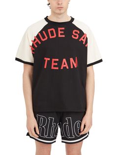 Black-White RHUDE T-SHIRT OIL CORP RAGLAN Athleisure Graphic Print T-shirt For Game Day, Sporty Crew Neck T-shirt With Graphic Print, Casual Crew T-shirt For Game Day, Black Varsity T-shirt With Screen Print, Black Varsity Cotton T-shirt, Black Cotton Varsity T-shirt, Black T-shirt For Game Day In Summer, Black Relaxed Fit T-shirt For Game Day, Black Relaxed Fit Varsity T-shirt