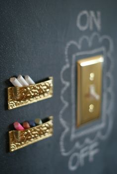 two switch plates with toothbrushes on the wall next to one light switch plate