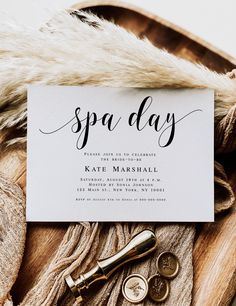 a white card that says spa day on it next to some keys and other items