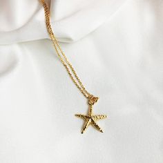 "This is wonderful GOLD STARFISH NECKLACE, The perfect Personalized Beach jewelry to wear everyday , you can add a simple touch to your look , its perfect for summer, beautifull detailing on both front and back. Great gift for all Sea Life lovers. ♡ DETAILS Necklace length : please choose Pendant : 1.5 cm- 0.59\" Material: 24k gold plated sterling silver 925 Please note that the chain may vary slightly from the ones shown above. ♡ PERSONALISATION How about adding one of my Swarovski birthstone p Ocean-inspired Gold Jewelry With Starfish Charm, Gold Starfish Clavicle Chain Necklace, Gold Jewelry With Starfish Charm As A Gift, Gold Jewelry With Starfish Charm For Gift, Gold Charm Necklace With Starfish Charm, Starfish Charm Necklace Perfect For Gifts, Starfish Charm Necklaces For Gifts, Starfish Charm Necklace As Gift, Starfish Charm Necklaces As Gift