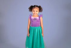 Transform your little one into a little mermaid with our magical princess dress. The dress features a super soft lilac stretch velvet bodice with a round neckline, flutter sleeves and a pleated turquoise skirt . The sleeves and skirt are made from multiple layers of shimmering tulle, bringing the magic of the reflecting water into life. Adding a final special touch is a sequin embroidered sea star that shines bring in the center neckline, reminding this ocean princess that home is where the heart is. Joy by Teresita Orillac costume -No zipper , comfortable , non itchy , tag less ,for kid friendly dressing Mermaid Royalty, Mermaid Princess Costume, Joy Costume, Ocean Princess, Turquoise Skirt, Girls Sleepwear, Princess Costume, Mermaid Princess, Turquoise And Purple