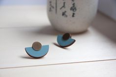 Sky blue semicircle wooden stud earrings with antique brass discs! These earrings are very lightweight and perfect for everyday wear, made by well chosen solid wood, hand painted and then protected with varnish: this makes the frontside waterproof while the backside is left in natural wood to ensure a better skin contact. These earrings will be shipped in elegant Studionat gift box! Details: Earring size - 2,5 cm in diameter (wide), 1,75 cm tall Made from - solid wood, acrylic paint and varnish, antique brass discs Ear posts - surgical steel / silver 925 ; nickel free For any request about size or colors don't hesitate to contact me: I'll do my best to make you satisfied! Please note that the item in the picture is a sample. Every piece is an original one and therefore there may be differe Natural Oils For Skin, Painted Jewelry, Wood Acrylic, Hand Painted Jewelry, Fan Earrings, Wooden Earrings, Blue Baby, Modern Earrings, Oils For Skin