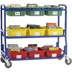 a blue cart filled with lots of books and bins on top of each other