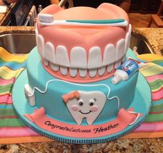 there is a cake made to look like a toothbrush and dental floss on top