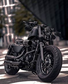 a black motorcycle is parked on the street