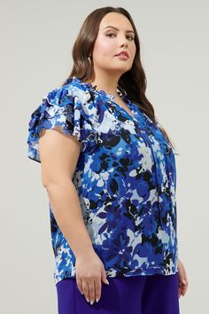 Elevate your outfit with tonal blue floral motifs. They decorate the Montie blouse that features a ruffle layered sleeve to frame a split neckline. Its lightweight fabric creates a flowy fit and can be styled tucked into high waisted trousers.- Flouncy- Standard fit- Split neckline- Lined- Color: White BluesSize + Fit - Model is 5'9" and wearing size 2X- Measurements taken from size 2X - Chest: 27"- Length: 30" Fabric Self: 100% Polyester, Lining: 97% Polyester, 3% Spandex Style Number STT16603P Tie Neck Blouse, Moon Flower, Floral Motifs, High Waisted Trousers, Tie Neck, Floral Motif, Lightweight Fabric, Blue Floral, Neck Tie