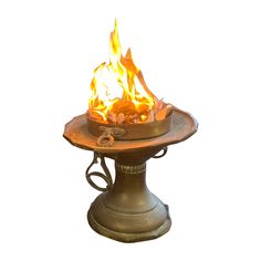 a fire pit sitting on top of a metal stand with flames coming out of it