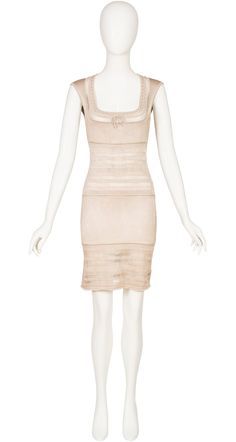 This 1993 S/S Azzedine Alaïa bodycon dress was made in Italy of an unlined light beige viscose knit with crocheted insets. The crochet dresses from this collection were recently re-released for Alaïa's "Edition" line. This one features a scoop neck with a bow detail. It fastens at the back with a concealed zipper. It's in very good condition, professionally dry-cleaned and ready to wear. Measurements: Bust - 30" (stretches to 38") Waist - 22" (stretches to 29") Hips - 30" (stretches to 38") Length - 35" IMPORTANT NOTE FOR CANADIAN SHOPPERS: There is a 15% shipping fee that is automatically applied to Canadian orders, as legally we need to charge and remit sales tax domestically. We will promptly refund any overcharge, and apologize for any inconvenience. Elegant Stretch Crochet Dress In Mini Length, Elegant Fitted Knee-length Crochet Dress, Elegant Fitted Crochet Mini Dress, Elegant Fitted Sleeveless Crochet Dress, Beige Fitted Sheath Bodycon Dress, Fitted Sleeveless Crochet Evening Dress, Fitted Beige Sheath Bodycon Dress, Beige Fitted Knee-length Crochet Dress, Beige Fitted Crochet Dress Knee-length