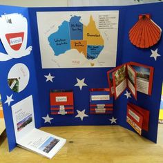 a blue and white display with red, white, and blue paper cutouts on it