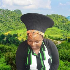 Black Zulu Hat is embellished with orange and silver beads is called ISICHOLO in traditional Zulu language and is traditionally worn during religious and cultural ceremonies. by the married Zulu woman of South Africa   The form of the isicholo, or married woman's hat, developed out of a 19th-century conical hairstyle that was worn as a sign of respect to one's husband and his family, in addition to serving as a public symbol of married status. In the early 20th century, a removable hat like this Traditional Black Ceremonial Costume Hats And Headpieces, Traditional Black Costume Hats And Headpieces For Ceremonial Occasions, Ceremonial Black Handmade Hats, Ceremonial Handmade Black Hat, Traditional Handmade Black Hat Bands, Traditional Black Costume Hats For Festivals, Traditional Black Costume Hats And Headpieces For Festivals, Traditional Black Hat Bands For Festival, Traditional Black Festival Hat