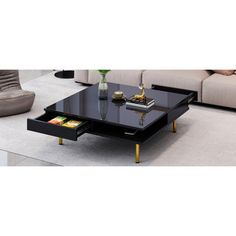 a black coffee table with yellow legs in a living room