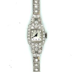 For a slender wrist, this all Platinum diamond line bracelet and case feels plush like silk... fitting on a wrist no larger than six inches in size. The case is set with diamonds on the bezel and shoulders; 13.15 pennyweights including the movement and crystal. The net platinum weight is 11.2 pennyweights / 17.4 grams.  Condition - The movement is in running order - keeps time within 5 minutes per day. The face is silvery white in clean condition. The Arabic numerals and blued steel hands are original with no visible rust or tarnish. The shoulders on both sides were repaired with gold solder. The photo exaggerates the color contrast between the gold solder and the platinum bracelet. 95% PLAT / 5% Ruthenium. If you can easily wrap a dollar bill around your wrist, this watch will fit you per Classic Diamond Watch With Jubilee Bracelet For Formal Occasions, Classic Formal Diamond Watch With Jubilee Bracelet, Classic Diamond Watch Bands For Formal Occasions, Classic White Gold Diamond Watch With Jubilee Bracelet, Classic Wedding Watches In Diamond White, Classic Formal Jewelry And Watches With Diamond, Classic Formal Diamond Jewelry And Watches, Classic Diamond Bracelet For Evening, Diamond Anniversary Watch With Jubilee Bracelet