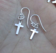 "Sterling Silver Large Cross Earrings measures from the top of the earwire to the bottom of the cross 1-1/4\" or 36mm The cross alone measures:cross is 3/4\" by 3/8\" Price is for one pair @ $13.50 Sterling Silver Large Hammered Cross Earrings measure:from the top of the earwire to the bottom of the cross 1-1/4\" or 36mm The cross alone measure 3/4\" x 3/8\" Price is for one pair at $14.80 Sterling Silver Small Cross earrings measure from top of the earwire to the bottom:1-1/8\" tall The cross a Hypoallergenic Cross Earrings, Nickel Free Adjustable Cross Earrings, Sterling Silver Cross Earrings With Ear Wire, Minimalist Hypoallergenic Cross Earrings, Silver Cross Earrings, Silver Lights, Small Crosses, Cross Earrings, Sterling Silver Cross