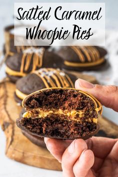 someone is holding up a chocolate sandwich with an egg in it and the words, salted caramel whoopie pies