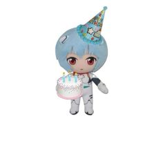 a small doll holding a cake with candles on it's head and wearing a party hat