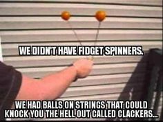 a man holding two orange balls in front of his face with the caption, we don't have fridge spinners