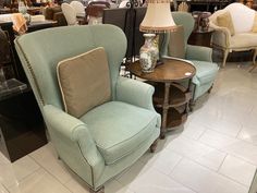 two chairs and a table in a store