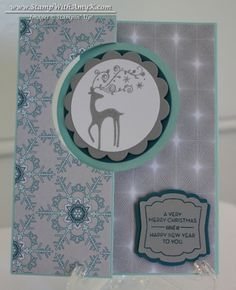 a close up of a christmas card with a deer on the front and an ornament in the back