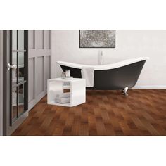 a bath tub sitting on top of a wooden floor