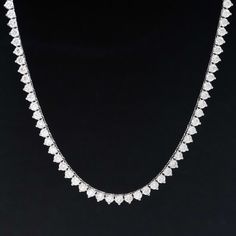 A classic diamond tennis necklace in white gold, with sparkly round brilliants sure to spruce up your neck stack! Each diamond sits in three prongs, all uniform in size, incredibly bright and white in color. We love the subtle touch of yellow gold that peaks through, making it the perfect piece to dress up any outfit. 14kt white gold 16.6" in length Diamonds are estimated to be colors & clarities. GIA Standards Please see qualitative report for more information. Anniversary White Diamond Tennis Necklace, Diamond White Tennis Necklace With Diamond Cut, White Round Cut Tennis Necklace For Anniversary, White Diamond Tennis Necklace With Vvs Clarity, Anniversary White Tennis Necklace With Single Cut Diamonds, White Tennis Necklace With Single Cut Diamonds For Anniversary, White Solitaire Necklace With Single Strand, White Diamond Necklace With Single Cut Heart Shaped Diamonds, White Diamond Cut Cubic Zirconia Necklace