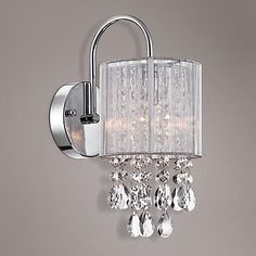 a chrome finish wall light with crystal drops