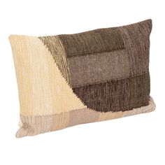 a brown and beige pillow on a white background