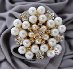 Rhinestone Pearl Brooch Embellishment - Flatback - Rhinestone Broach - Brooch Bouquet - Supply - Wedding Jewelry Supply - RD73 Flatback. Also available in silver base. Please check other listings. If you would like to purchase a brooch pin, you can find one here: https://www.etsy.com/listing/178122487/1-pc-silver-plated-pin-back-brooch-pins Can be glued using E6000 or other type of industrial strength glue. Can be wired using floral wire. Can also be used to make Jewelry. Approx. 2 inches We mak Brooch Bouquet Diy, Bouquet Cake, Bridal Brooch Bouquet, Wedding Brooch Bouquets, Brooch Diy, Brooch Bouquet, Wedding Brooch, Make Jewelry, Floral Wire