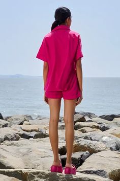 Pink cotton shirt with half sleeves and collar. Paired with shorts with side pockets.
Components: 2
Pattern: Plain
Neckline: Collar
Sleeve Type: Half Sleeves
Fabric: 100% Cotton
Color: Pink
Other Details: 
Side slits
Closure:
Shirt: Front concealed placket
Shorts: Elasticated waistband
Occasion: Resort - Aza Fashions Cotton Short Sleeve Short Set For Vacation, Short Cotton Sets With Pockets, Cotton Sets With Pockets And Short Length, Cotton Beach Sets With Short Length, Cotton Beach Sets In Short Length, Relaxed Fit Short Sets With Pockets, Beach Short Length Cotton Short Set, Shirt And Shorts Set, Eco Friendly Clothing