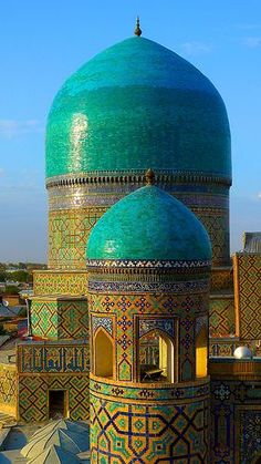 an ornate building with blue and green tiles on it