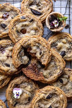 chocolate chip cookies on a cooling rack with flowers and oreos in the middle, ready to be eaten